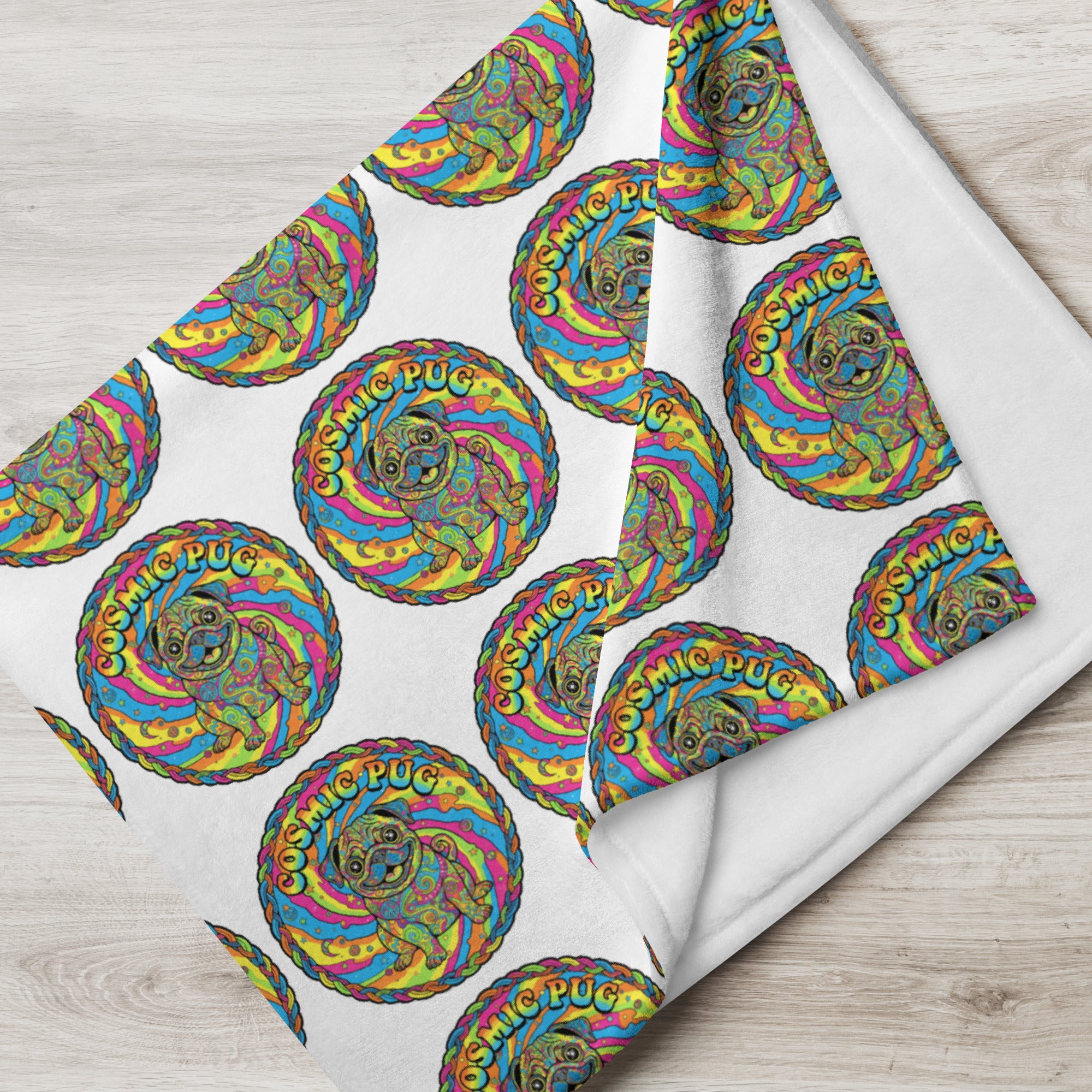 Cosmic Pug throw blanket by Leaky Ts featuring a playful pug design, soft fabric, and celestial-themed pattern, 30x40 inches.