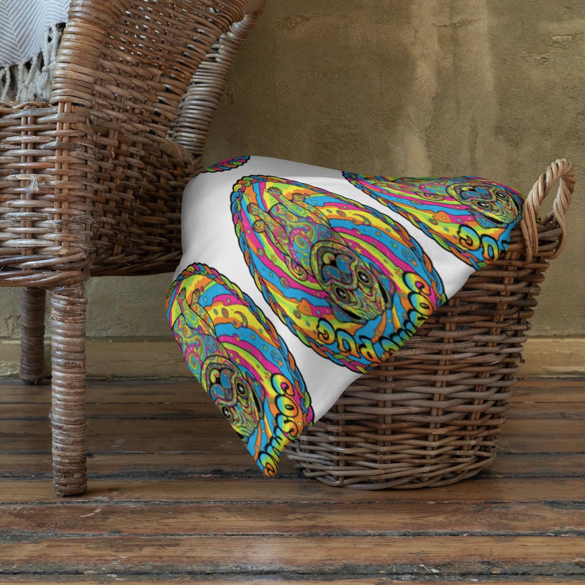 Leaky ts Cosmic Pug throw blanket featuring a colorful pug design, 60x80 inches, draped over a cozy sofa for a stylish look.