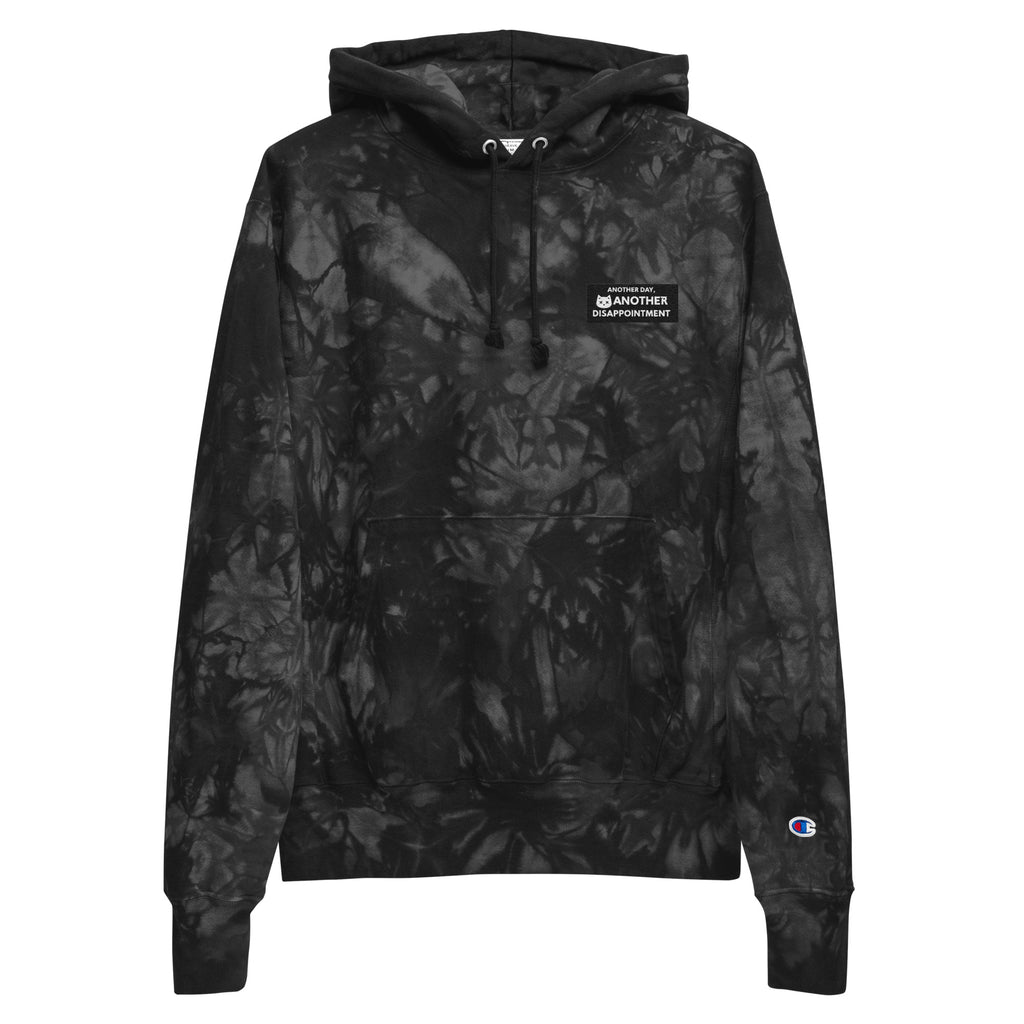 Unisex Champion Leak-Dye Hoodie by Leaky Ts featuring black tie-dye pattern and front design, casual and stylish for everyday wear.