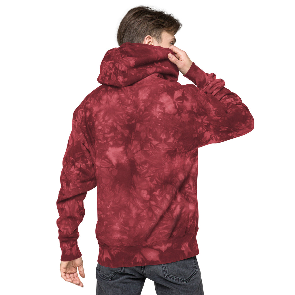 Leaky ts Champion leak-dye hoodie in mulled berry, unisex with a relaxed fit and vibrant tie-dye pattern on the back.