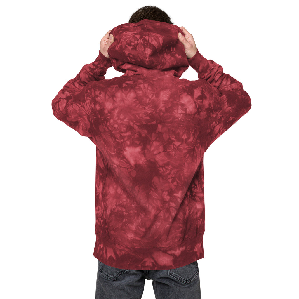 Unisex Champion Leak-Dye Hoodie by Leaky Ts in Mulled Berry with back view, showcasing vibrant, abstract tie-dye pattern.