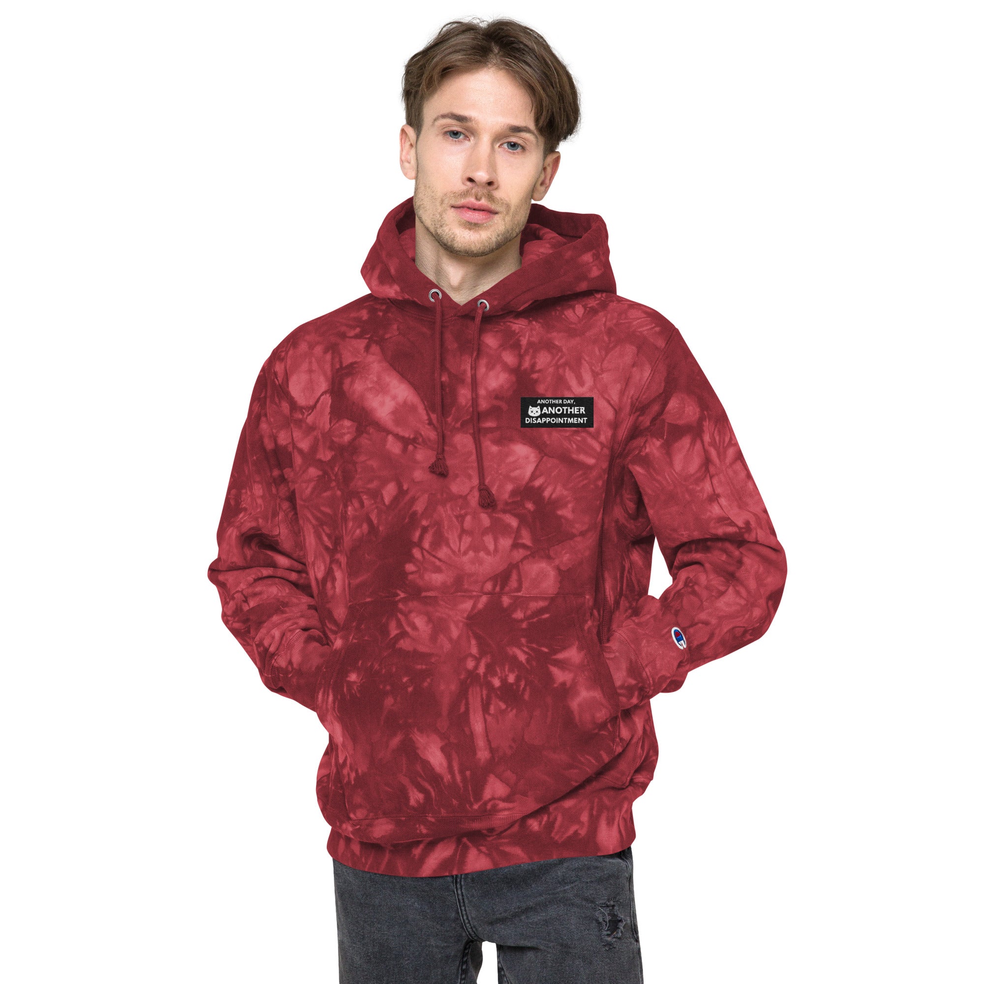 Unisex Champion Leak-Dye Hoodie in Mulled Berry with vibrant tie-dye pattern and front design, by Leaky ts.