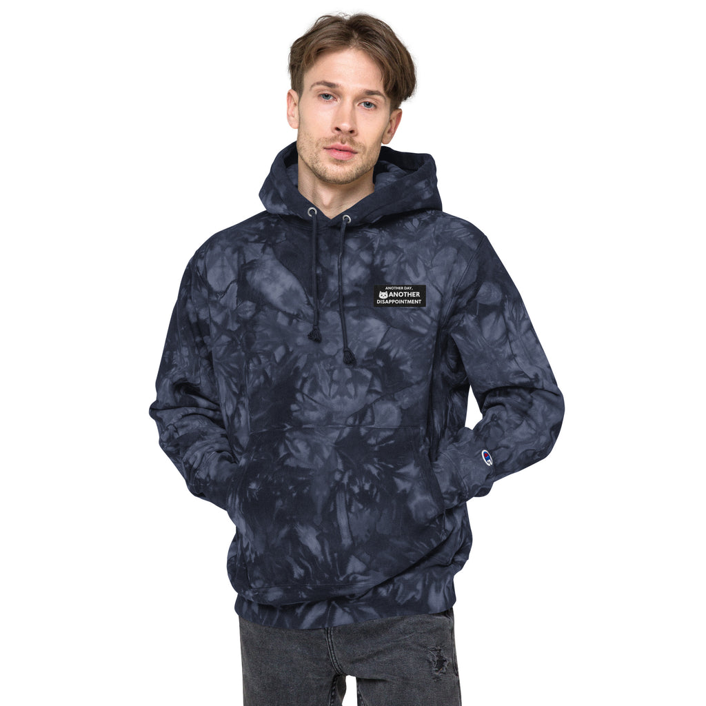Unisex navy Champion Leak-Dye Hoodie by Leaky ts featuring bold, irregular tie-dye patterns and a front design.