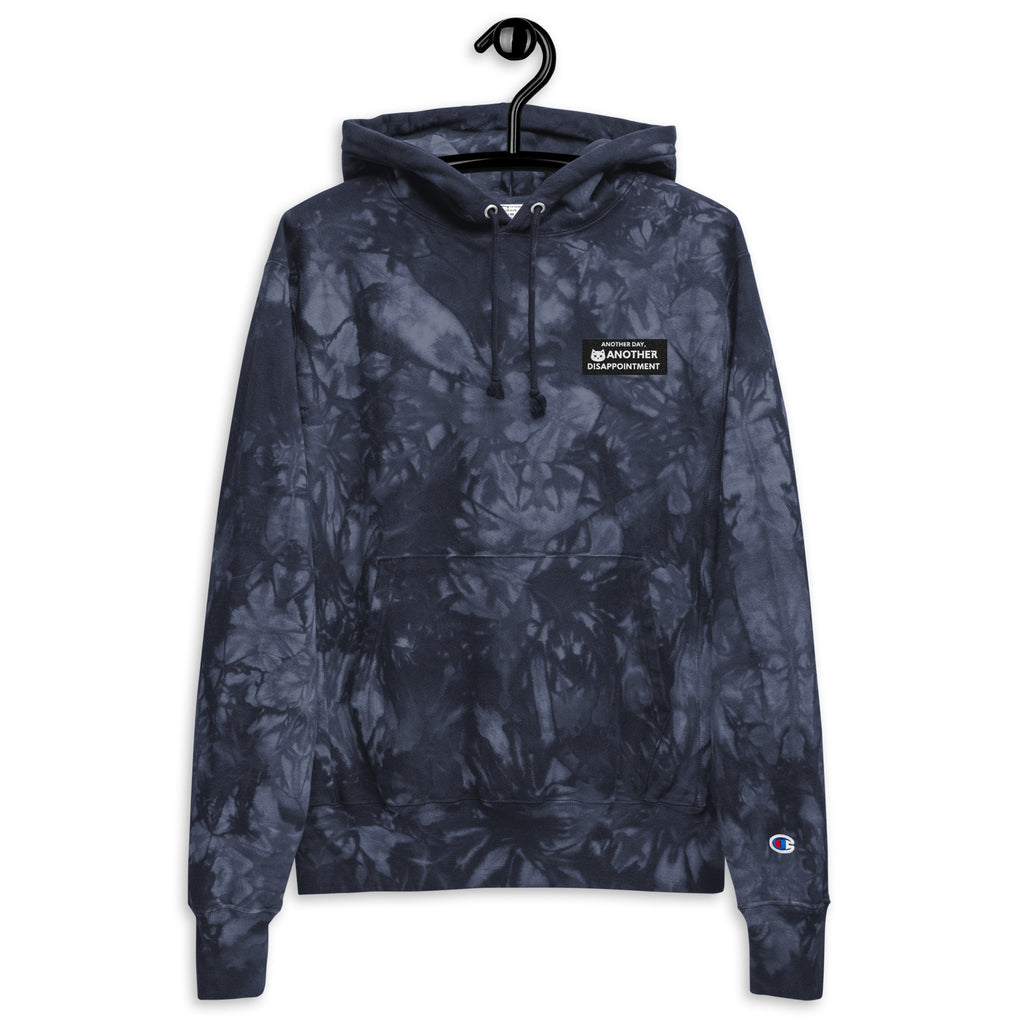 Unisex navy Champion leak-dye hoodie by Leaky ts with a front view, showcasing the unique leak-dye pattern and casual fit.