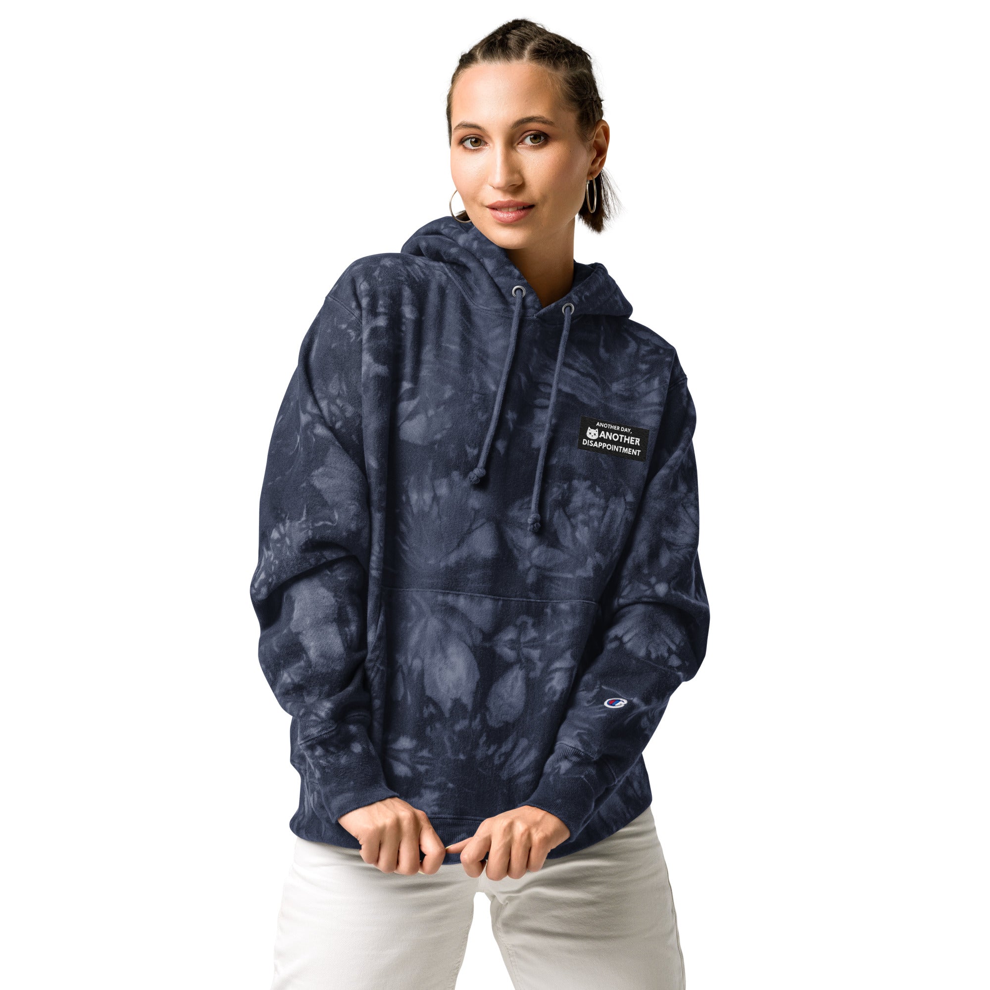 Unisex navy Champion Leak-Dye Hoodie by Leaky ts featuring a bold, unique tie-dye pattern on the front.