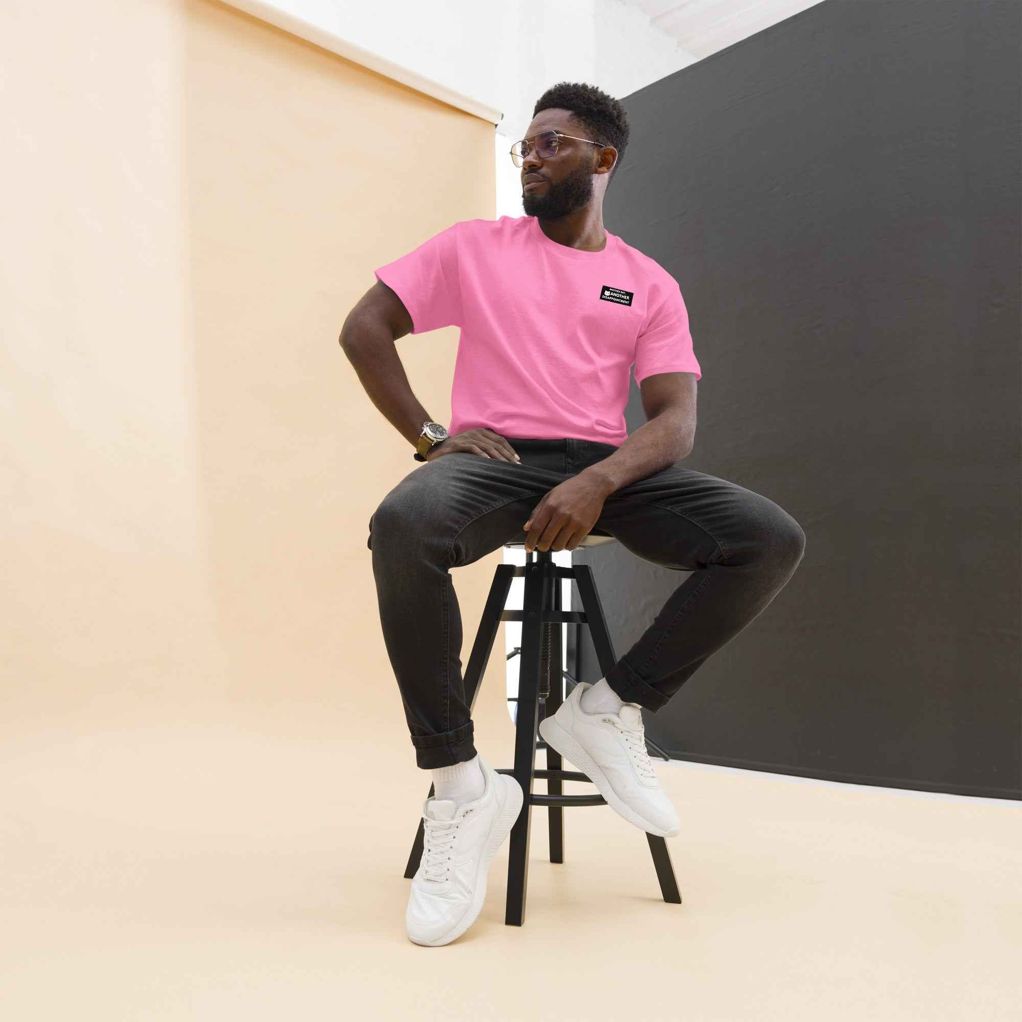 Unisex classic tee by Leaky Ts with "Another Day Another Disappointment" print in azalea color, front view.