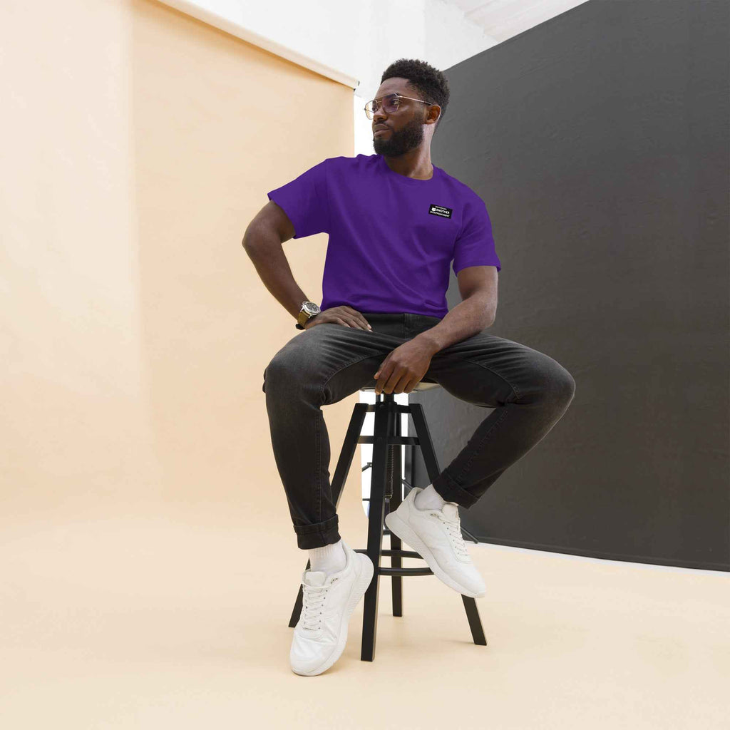 Unisex classic purple tee featuring the "Another Day Another Disappointment" graphic by Leaky TS, front view.