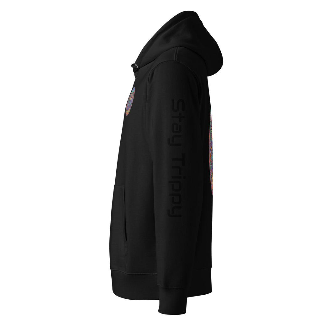 Unisex black Stay Trippy hoodie by Leaky Ts made from 100% organic cotton, displayed hanging on a wall.